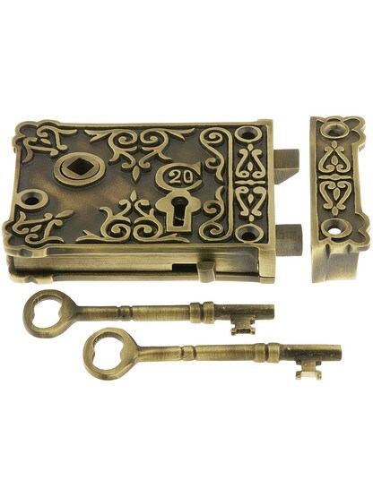 Solid Brass Small Ornate Rim Lock in Antique Brass.